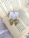 Studded bow pearl earring